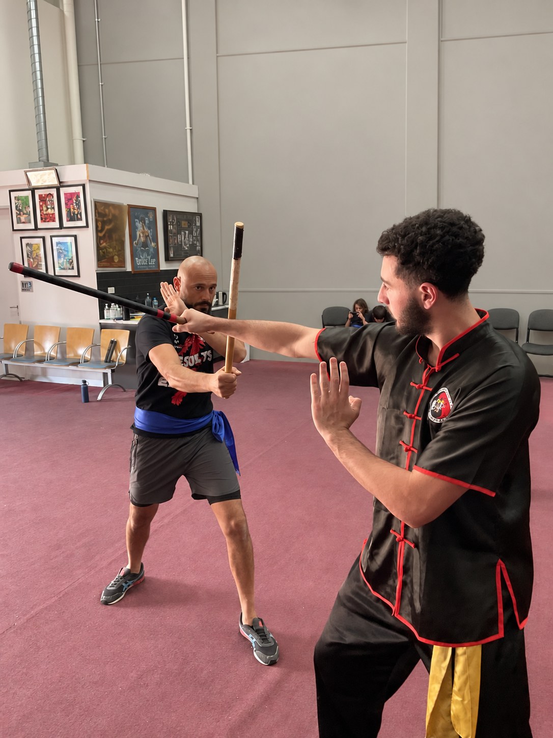 A Wing Chun instructor guiding a student during focused training