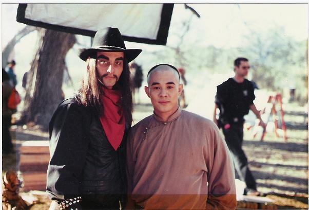 Joe Sayah in Bandit Leader costume standing with Jet Li