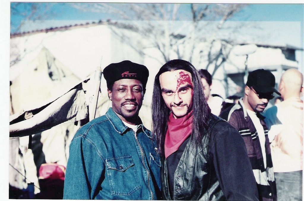 Wesley Snipes standing with Joe Sayah while Joe is in film costume