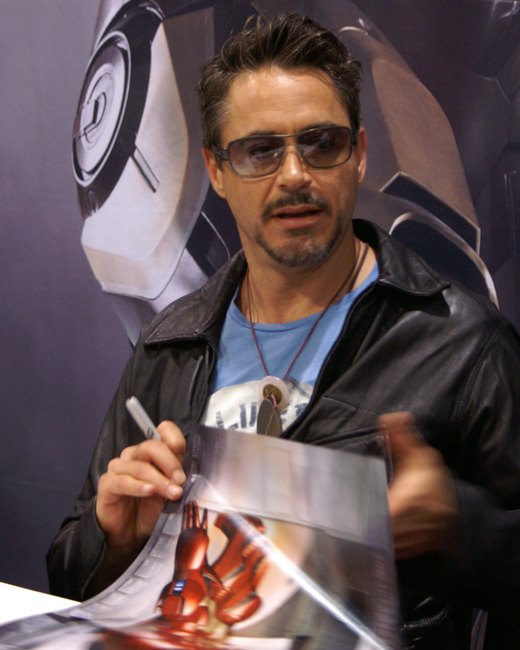Robert Downey Jr. at Comic-Con in 2007 with Iron Man artwork