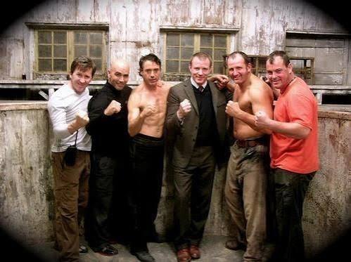 Robert Downey Jr. and members of the Sherlock Holmes production team during filming